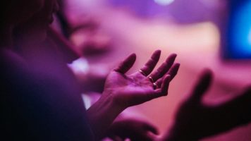 Hand held in worship