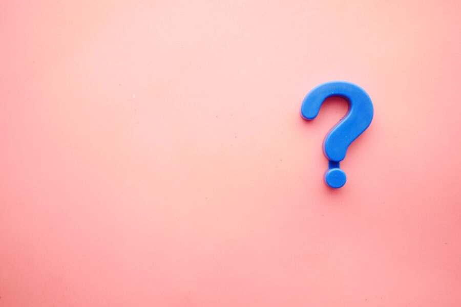 Question mark against pink background