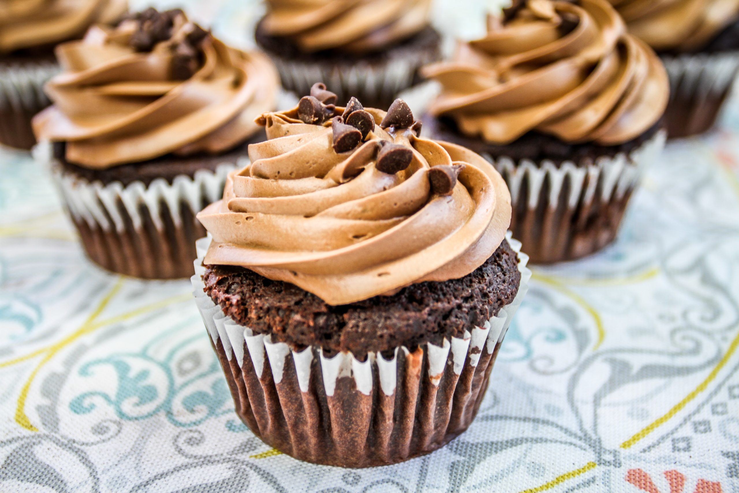 Chocolate cupcakes with butter cream and chocolate sprinkles