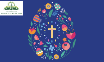 an egg shape made with flower designs and a cross at the centre