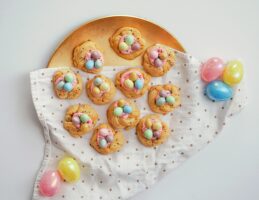 a plate full of cookies with chocolate easter eggs on top