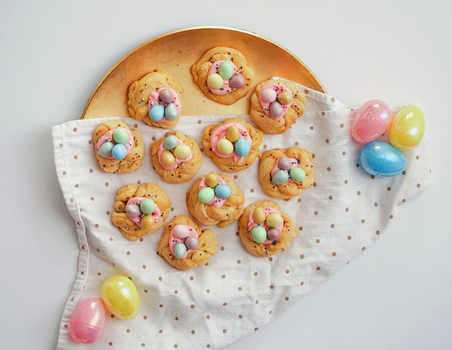 a plate full of cookies with chocolate easter eggs on top