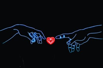 neon image of God creating man from Sistine Chapel with heart between