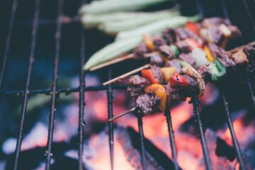 Kebabs cooking on a barbecue
